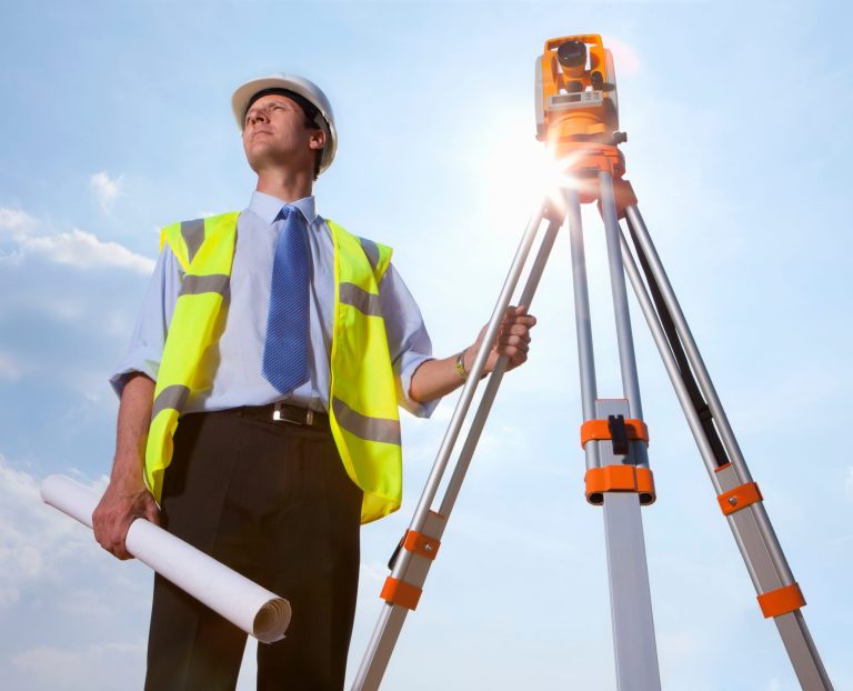 a-low-angle-medium-shot-of-a-surveyor-standing-wit-2026-01-11-08-41-49-utc